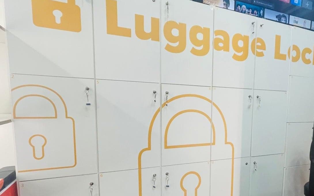 A wall of white numbered lockers inside the Capri shop